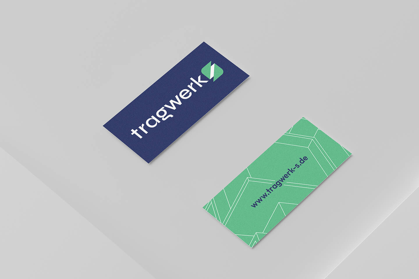 tragwerk-s Visitenkarten mit blauem Logo und grünem Muster für die Webadresse.